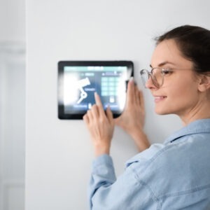 woman using in home security system
