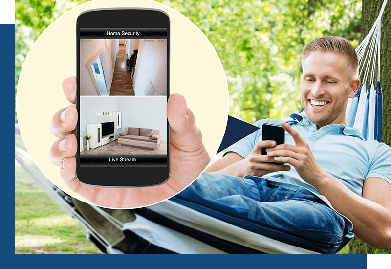 image if a man checking his home security system