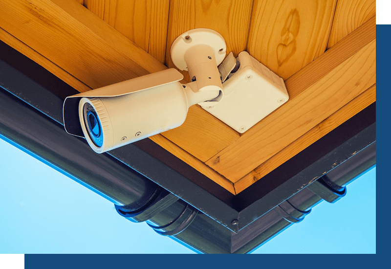 Security camera hidden under roof of home
