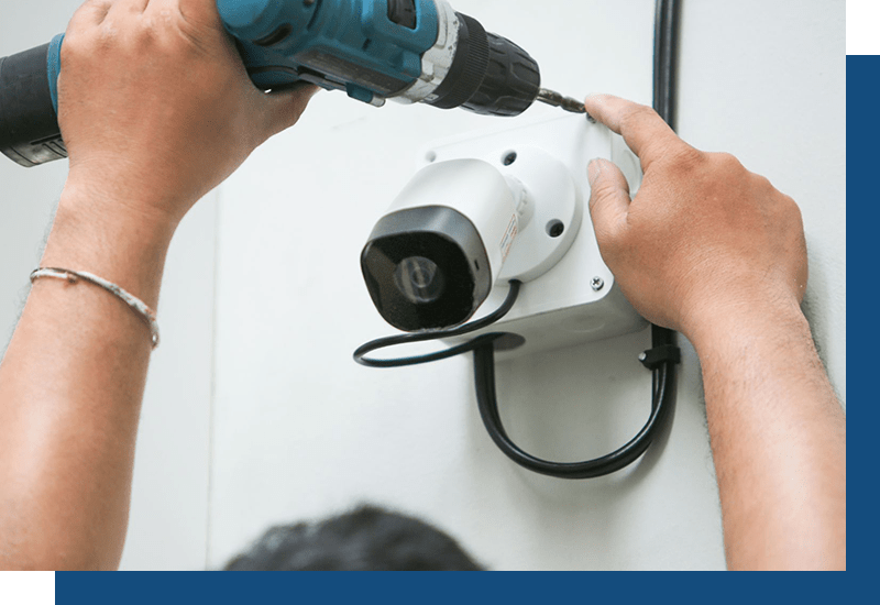 Person installing a security camera