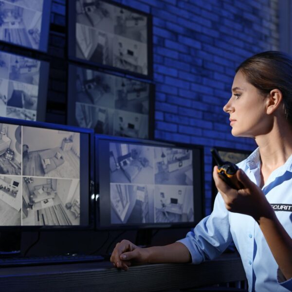 security woman monitoring live camera feeds
